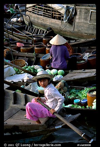 Child at Phung Hiep floating market. Can Tho, Vietnam (color)