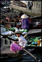 Child at Phung Hiep floating market. Can Tho, Vietnam