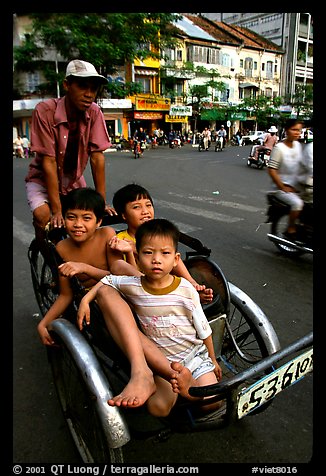 Kids sharing cyclo ride, Ho Chi Minh city. Vietnam (color)