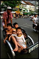 Kids sharing cyclo ride, Ho Chi Minh city. Vietnam