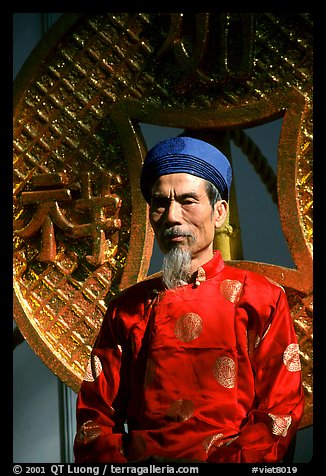 Elderly man in Ao Dai costume, a vanishing tradition. Ho Chi Minh City, Vietnam (color)