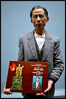 Former militia member with certificate of heroism, Hanoi. Vietnam (color)