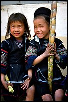 Black Hmong girls, with their daily fix of sugar cane, Sapa. Vietnam ( color)