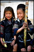 Black Hmong girls, with their daily fix of sugar cane, Sapa. Vietnam