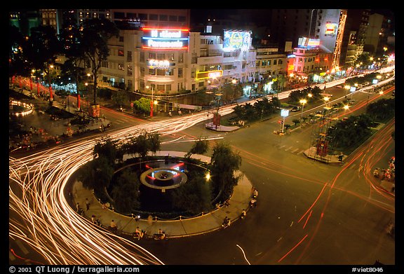 Intersection of Le Loi and Nguyen Hue boulevards at night. Ho Chi Minh City, Vietnam (color)