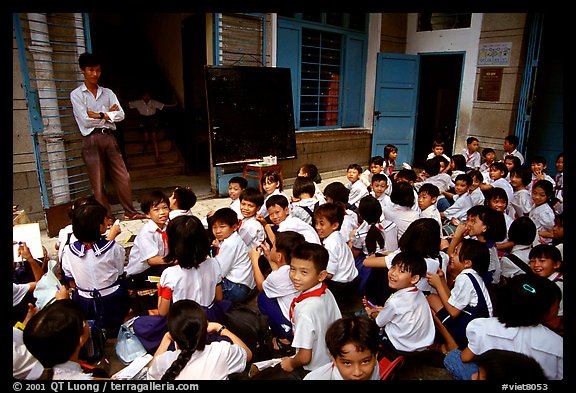 Children at school. Like everywhere else in Asia, uniforms are the norm. Ho Chi Minh City, Vietnam (color)
