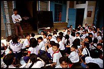 Children at school. Like everywhere else in Asia, uniforms are the norm. Ho Chi Minh City, Vietnam (color)