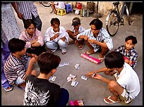 Children playing cards. Ho Chi Minh City, Vietnam (color)