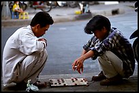 Chinese Chess game. Vietnamese people can sit on their heels for hours. Ho Chi Minh City, Vietnam ( color)