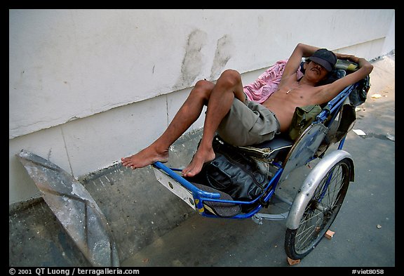 Cyclo driver taking an afternoon nap. Ho Chi Minh City, Vietnam (color)