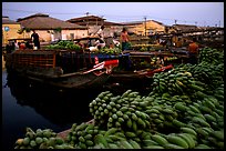 Boats bring loads of produce from the Delta on the Saigon arroyo. Ho Chi Minh City, Vietnam ( color)