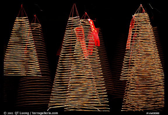 Incense coils  at a Chinese temple in Cho Lon, designed to burn for days. Cholon, District 5, Ho Chi Minh City, Vietnam (color)