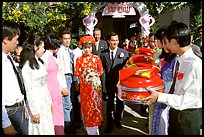 Exchange of gifts at wedding, upon exiting bride's home. The bride traditionaly wears red. Ho Chi Minh City, Vietnam ( color)