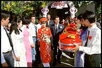 Exchange of gifts at wedding, upon exiting bride's home. The bride traditionaly wears red. Ho Chi Minh City, Vietnam