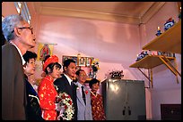 Bride presented to the groom's ancestors in the presence of both parents during a wedding. Ho Chi Minh City, Vietnam