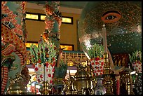 Globe with Cao Dai eye inside the great temple. Tay Ninh, Vietnam ( color)