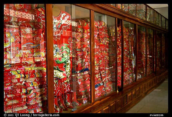 Gold-embroided dresses offered to Lady Chua Xu,. Chau Doc, Vietnam (color)