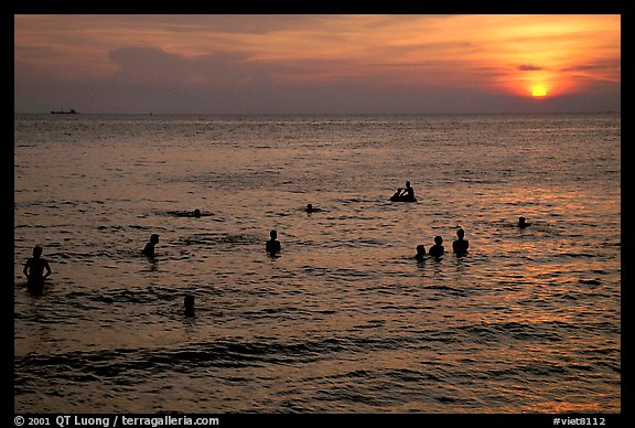 Soaking in the warm China sea at sunset. Vung Tau, Vietnam