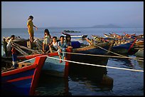 Children play on fishing boats. Vung Tau, Vietnam ( color)