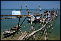 An ice block being loaded into a fishing boat. Vung Tau, Vietnam (color)