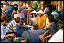 Filling up water tanks for the day. Ha Tien, Vietnam (color)