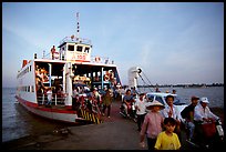Disembarking from a ferry on one of the many arms of the Mekong, My Tho. Mekong Delta, Vietnam ( color)