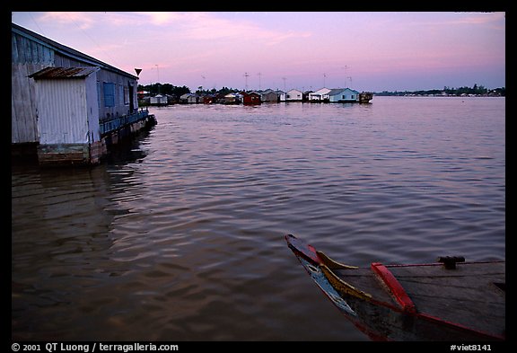 Floating houses. They double as fish reservoirs. Chau Doc, Vietnam (color)