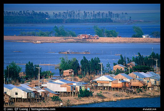 Stilts houses and inundated rice fields. Chau Doc, Vietnam (color)