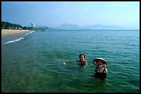 Early morning bath on a perfect beach Nha Trang. Vietnam (color)