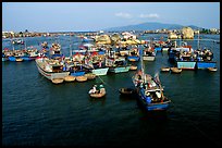 Colorfull fishing boats. Note the circular basket boats used to get to shore.  Nha Trang. Vietnam (color)