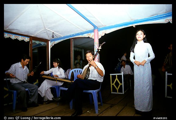 Traditional floating concert on the Perfume river. The city has remained Vietnam's artistic center. Hue, Vietnam