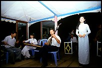 Traditional floating concert on the Perfume river. The city has remained Vietnam's artistic center. Hue, Vietnam (color)