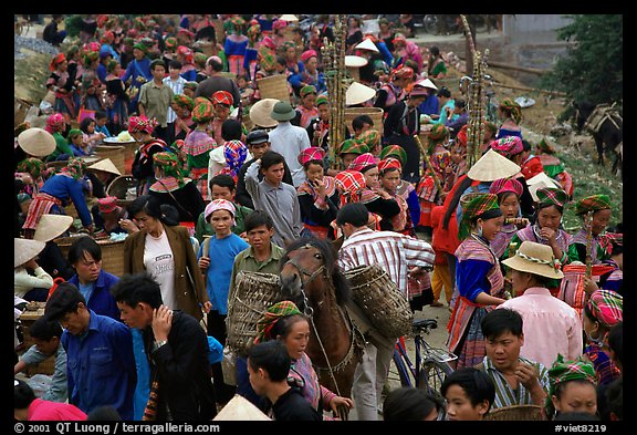 Colorful crowd at the sunday market, where people from the surrounding hamlets gather weekly to meet, shop and eat. Bac Ha, Vietnam (color)