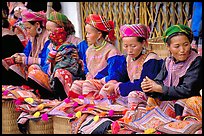 Women sell the colorful garnments after which the Flower Hmong are named. Bac Ha, Vietnam