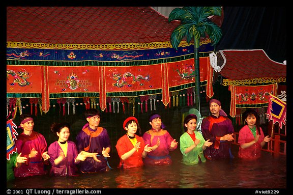 Artists salute after a water puppets performance in 1999. Hanoi, Vietnam (color)