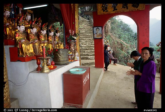 Praying at an outdoor temple. Perfume Pagoda, Vietnam