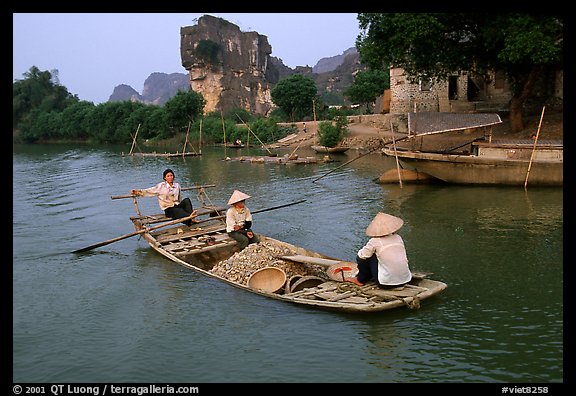 Villagers transport stones from the quary on Ken Ga canal. Ninh Binh,  Vietnam (color)