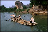 Villagers transport stones from the quary on Ken Ga canal. Ninh Binh,  Vietnam (color)