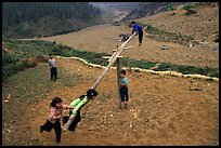 Children playing a rotating swing near Can Cau. Vietnam (color)