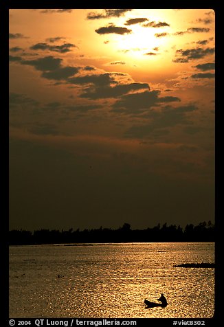 Small boat at sunrise. Chau Doc, Vietnam