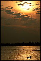 Small boat at sunrise. Chau Doc, Vietnam (color)