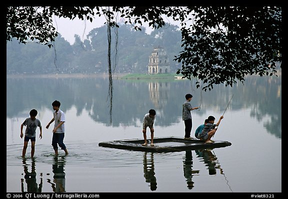 Children playing,  Hoan Kiem Lake. Hanoi, Vietnam (color)